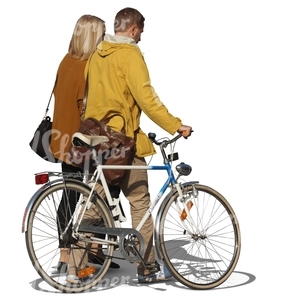 man and woman walking next to a bicycle