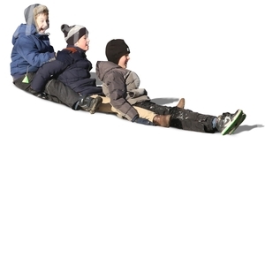 three boys sliding down an icy mountain