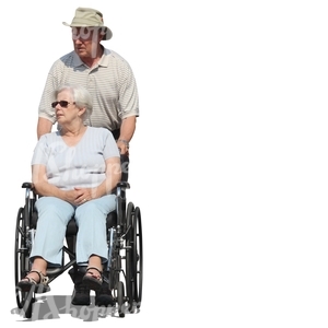 elderly man pushing a woman in a wheelchair