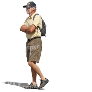 elderly man with a backpack walking