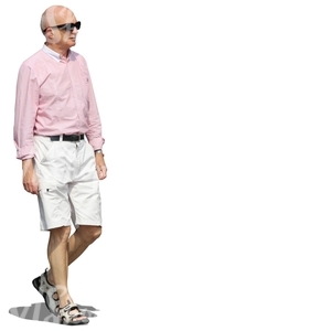 elderly man with sunglasses walking