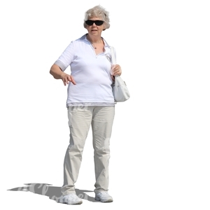 elderly woman in a white outfit standing