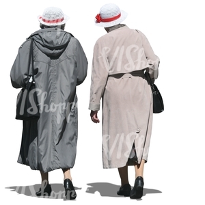 two elderly women wearing coats walking