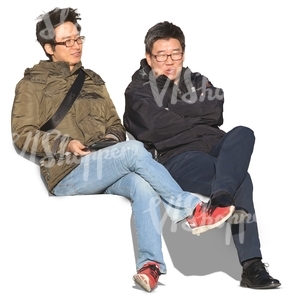 two asian men sitting and talking