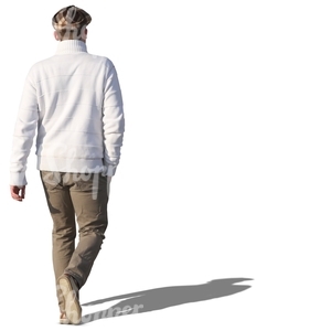 man in a white sweater walking