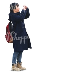 asian woman standing and taking a picture