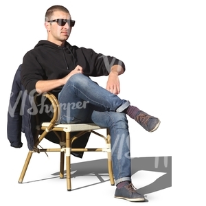 man sitting in a street cafe