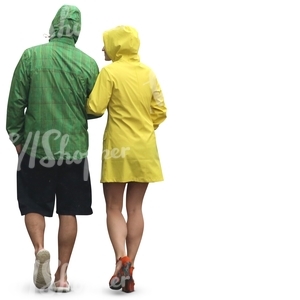 couple in colorul raincoats walking arm in arm