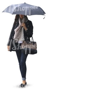 woman with a polka dot scarf walking under an umbrella