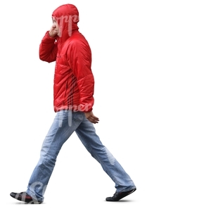 man in a red raincoat walking in the rain 
