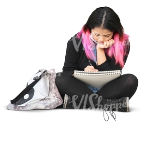 asian woman sitting and writing in her notebook