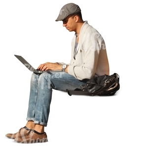 man sitting and working on his laptop