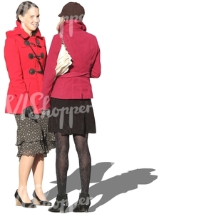 two women in red spring coats talking