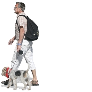 man with backpack walking a terrier