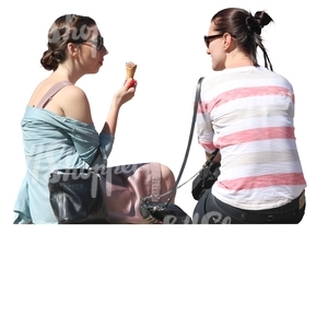 two women sitting and eating icecream