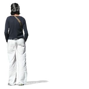 woman in white trousers standing