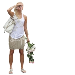 woman standing with flowers in her hand