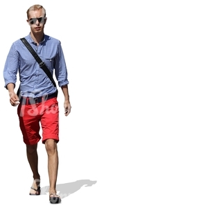 cut out young man in red shorts walking