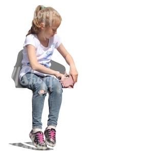 young girl sitting and looking in her handbag