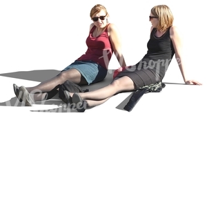 two women sitting with streched out legs
