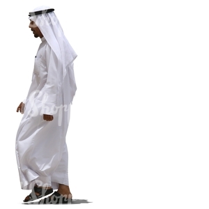 arab man in a white dishdasha walking