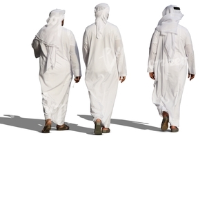 three arab men in white thobes walking