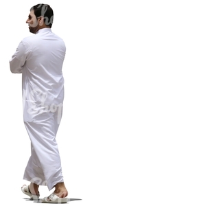 muslim man in a white thobe walking