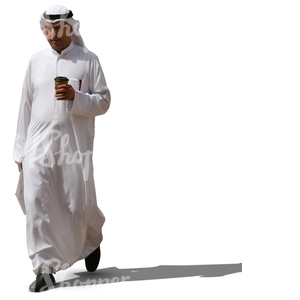 muslim man in a white thobe walking and drinking coffee