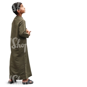 young muslim boy in a thobe standing