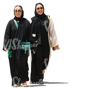 two muslim women walking and smiling