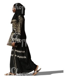 muslim woman in a decorated abaya walking