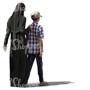 muslim woman walking with her son