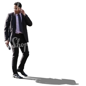 cut out backlit businessman walking