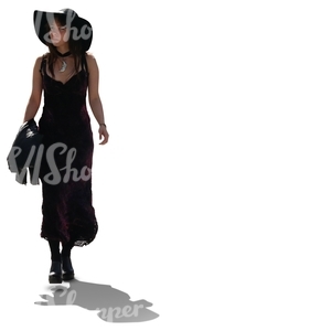 cut out backlit woman in a black dress walking