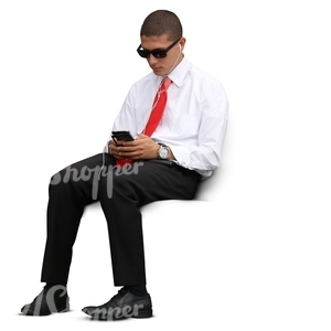 cut out businessman sitting and looking at his phone