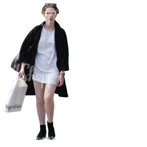 stylish woman in black and white with a shopping bag