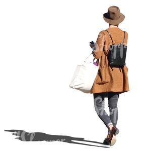 cut out woman in a stylish brown coat walking