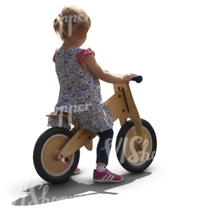 young girl riding a likeabike