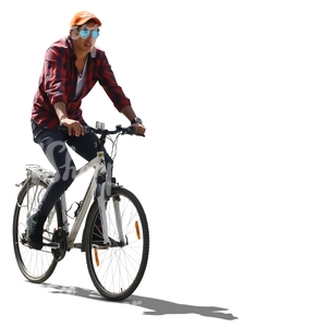backlit young man riding a bike