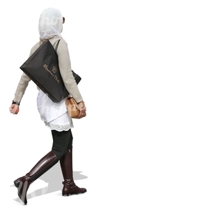 muslim woman walking with a large shopping bag