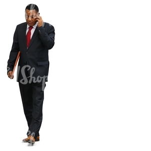 cut out black businessman walking while talking on the phone