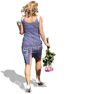 woman with blond curly hair and flowers walking