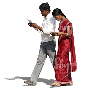 indian man and woman walking and reading something