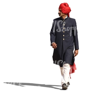 hindu man in a traditional attire and wearing a turban walking