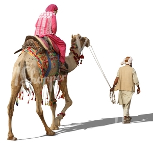 man steering a camel with a woman riding on it