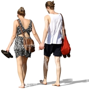young couple walking barefoot and hand in hand