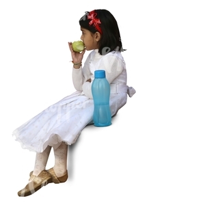 hindu girl in a festive white dress sitting