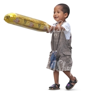 small latino boy with a toy walking