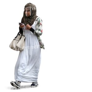 black muslim woman walking with a phone in her hand