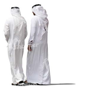 two arab man wearing dishdashas walking